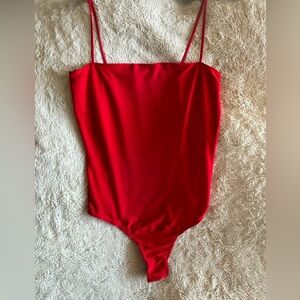 MISGUIDED Red strappy bodysuit that has a slight sheer